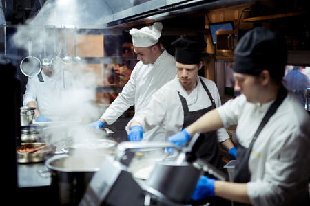 Chefs cooking in commercial kitchen