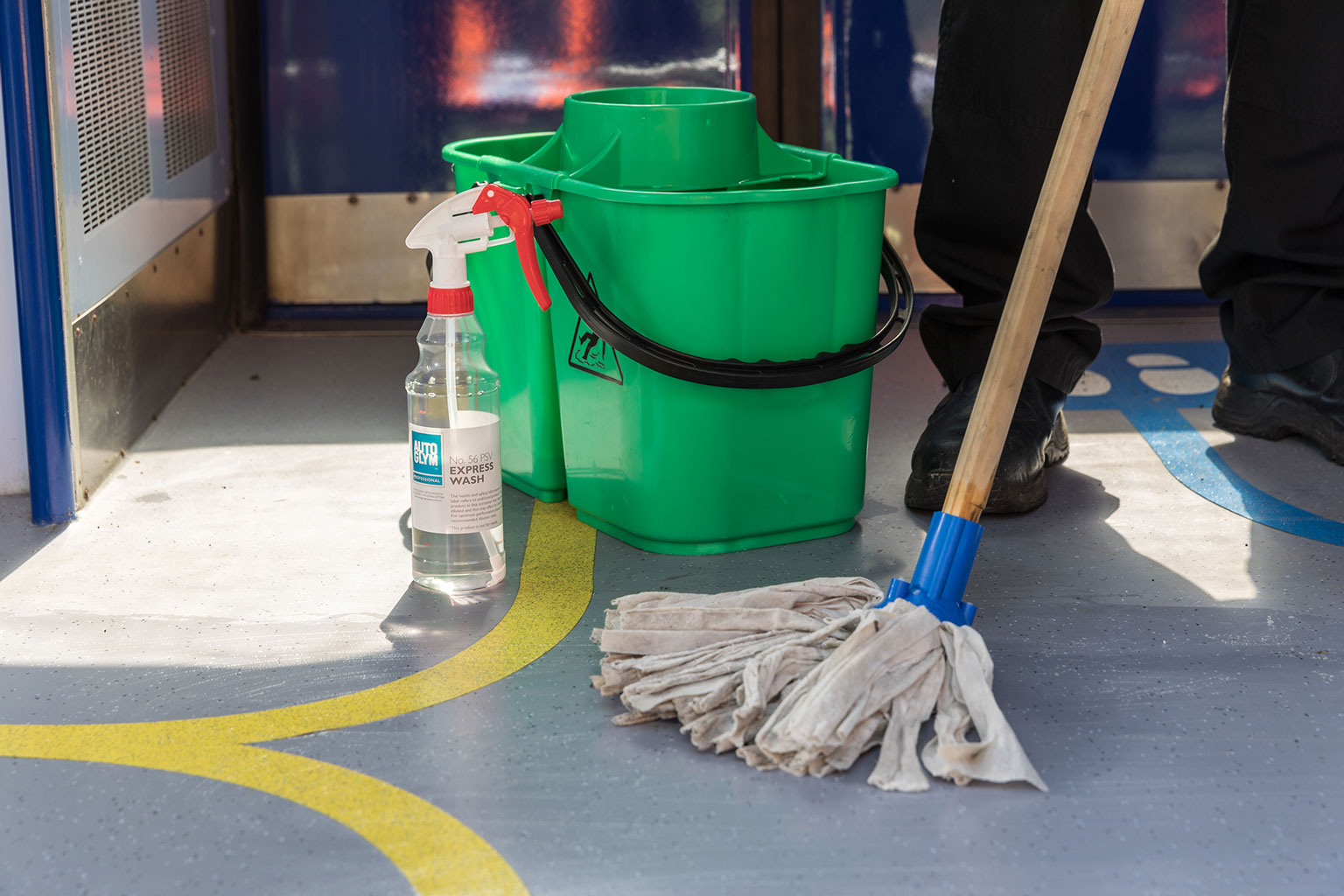 A bottle of Autoglym 52 ExpressWash in front of a green double bucket on the 2019 Porterbrook Innovation Hub