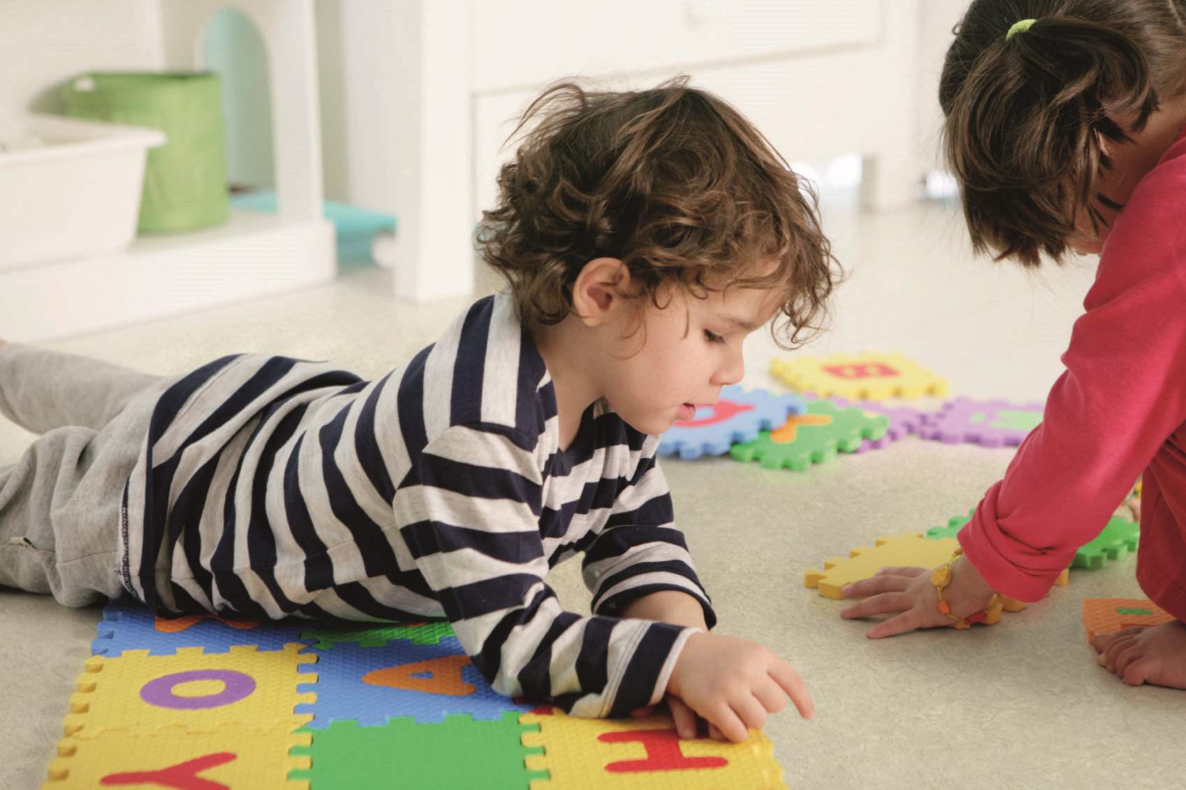 Students playing on classroom floor