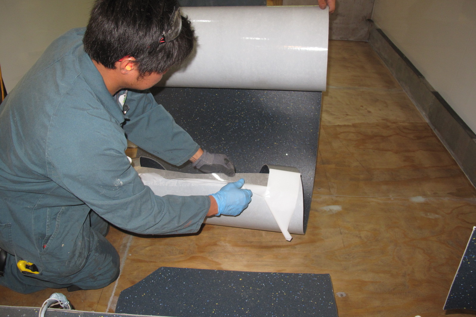 Altro self-adhesive safety flooring being installed